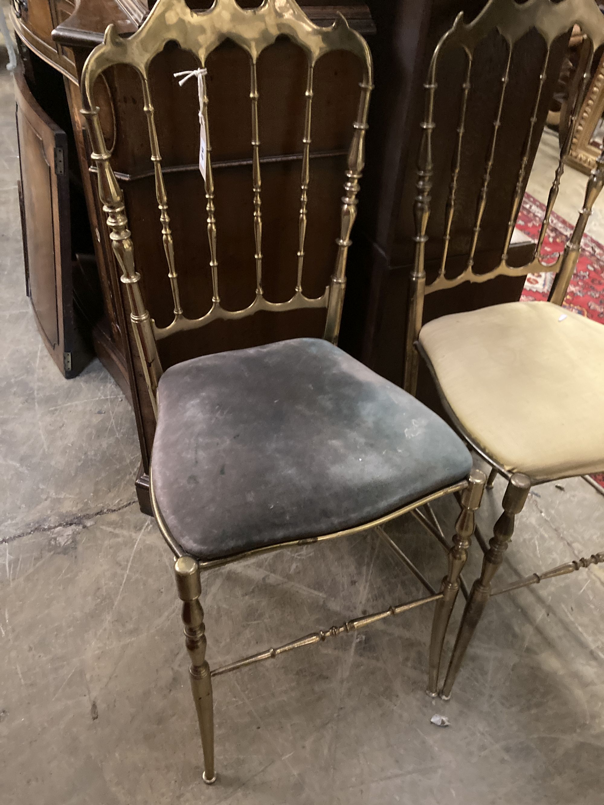 A pair of brass side chairs